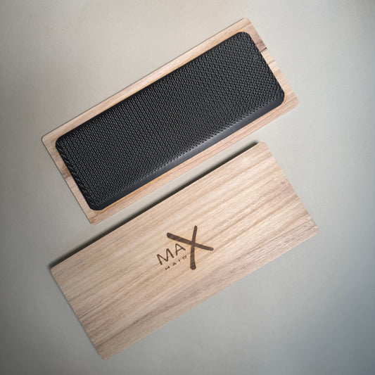 Carding tool on a wooden base